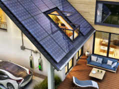 Fotowoltaika – chwilowy boom czy przyszłość energetyki? nowoczesney dom z panelami fotowoltaicznymi i samochodem elektrycznym